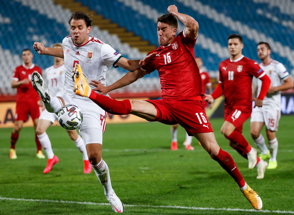 BELGRADE, SERBIA - OCTOBER 11: Dusan Vlahovic (R) of Serbia in action against Adam Szalai (L) of Hungary during the UEFA Nations League group stage match between Serbia and Hungary at Rajko Mitic Stadium on October 11, 2020 in Belgrade, Serbia. (Photo by 