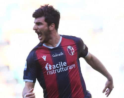 UDINE, ITALY - MAY 08: Riccardo Orsolini of Bologna F.C. 1909 celebrates after scoring their side's first goal during the Serie A match between Udinese Calcio and Bologna FC at Dacia Arena on May 08, 2021 in Udine, Italy. Sporting stadiums around Italy re