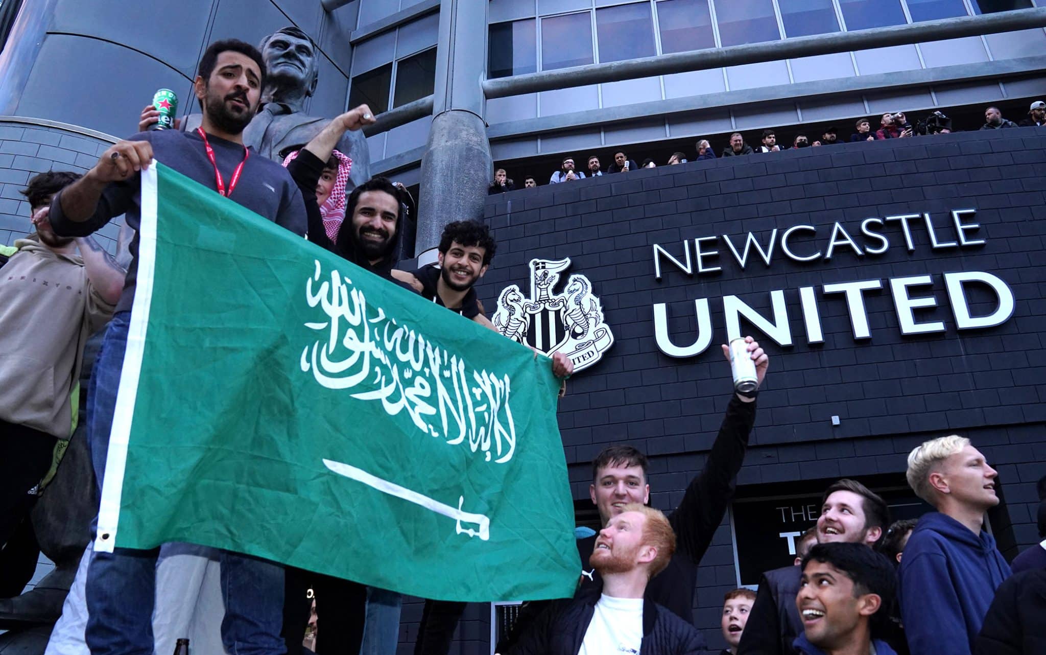 Newcastle United fans celebrate at St James' Park following the announcement that The Saudi-led takeover of Newcastle has been approved. Picture date: Thursday October 7, 2021.
