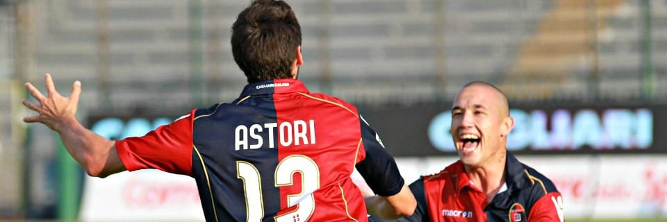 CAGLIARI, ITALY - MAY 22: Davide Astori celebrating the goal 1-1 with Radjia Nainggolan during the Serie A match between Cagliari Calcio and Parma FC at Stadio Sant'Elia on May 22, 2011 in Cagliari, Italy. (Photo by Enrico Locci/Getty Images)