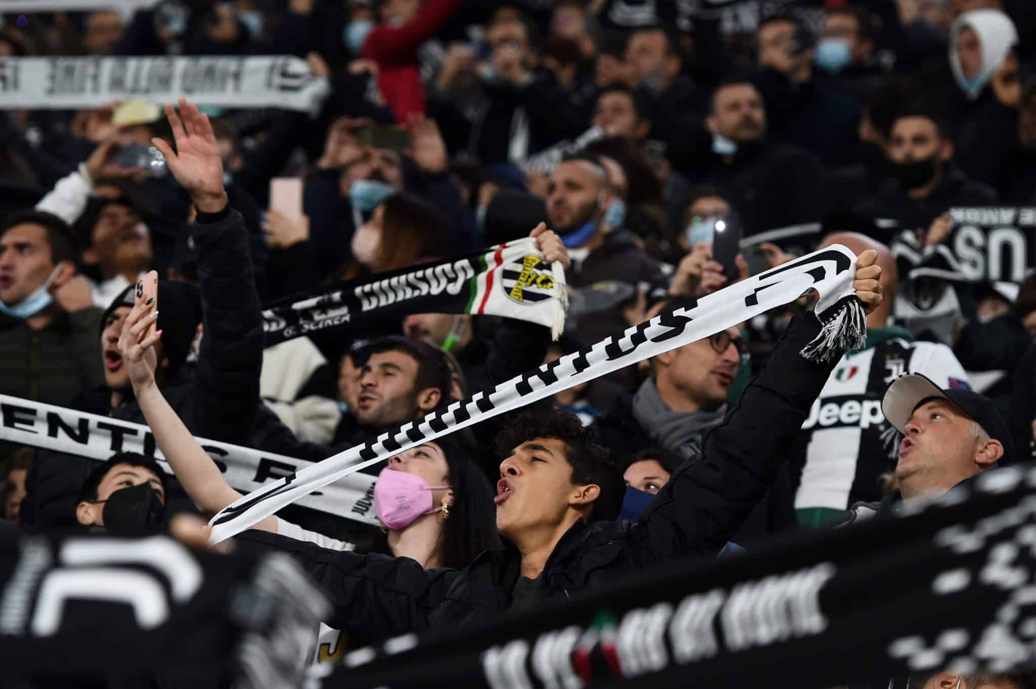 TURIN, ITALY - NOVEMBER 06: Juventus fans show their support by holding scarves prior to the Serie A match between Juventus FC and ACF Fiorentina at Allianz Stadium on November 06, 2021 in Turin, Italy. (Photo by Chris Ricco/Getty Images)
